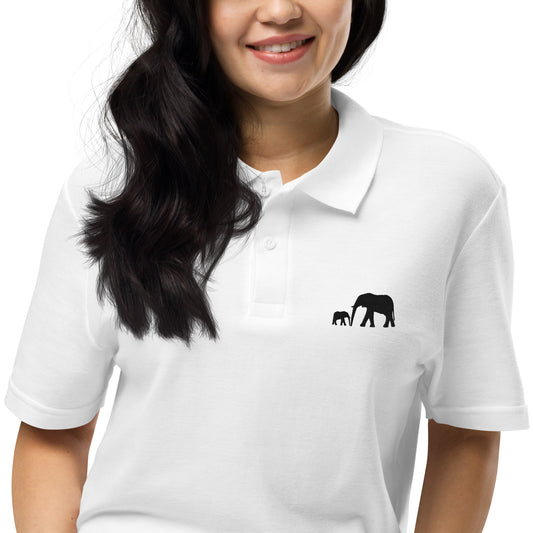 White and light grey polo shirts with black embroidered illustration of a mother elephant walking with her baby calf in a minimalist luxury wildlife design.