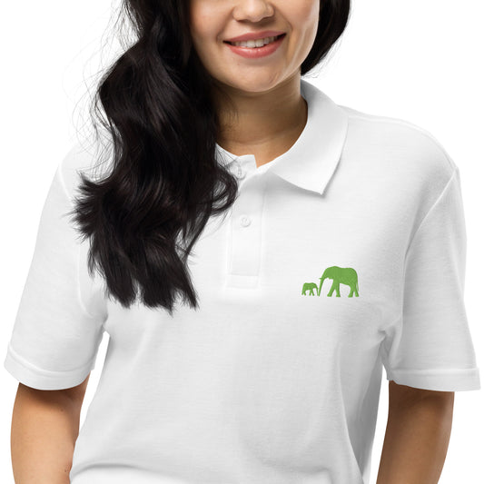 Black, navy, grey, and white polo shirts featuring bright kiwi green embroidered design of a mother elephant walking with her baby calf in a bold luxury wildlife style.