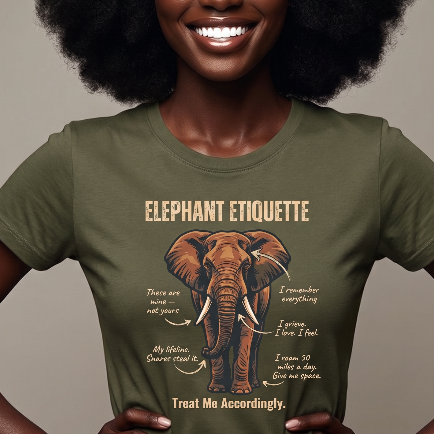 Person wearing a green t-shirt with an elephant graphic and text on a beige background. Elephant etiquette shirt for safari goers in africa